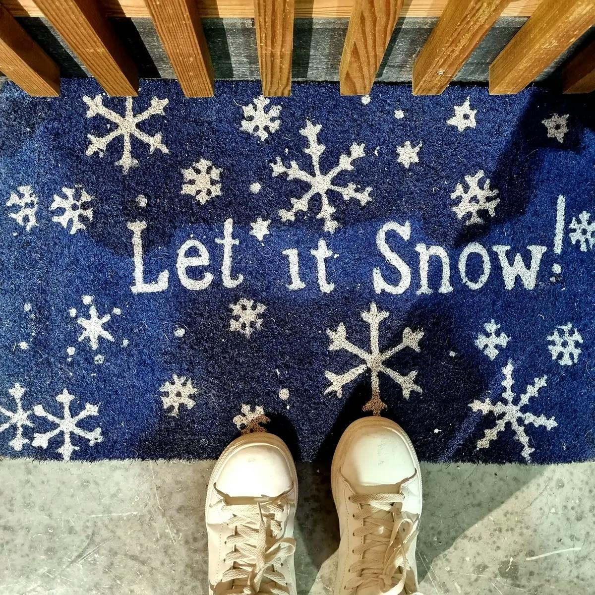 Blue holiday dormant that reads “Let it Snow.”