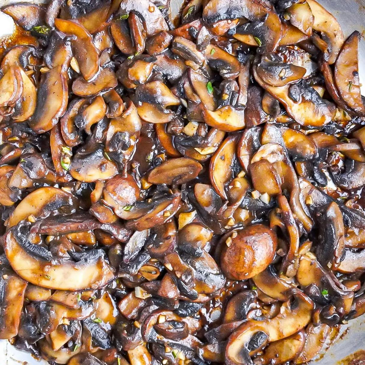 Mushrooms sautéed in butter to make a vegan holiday appetizer.