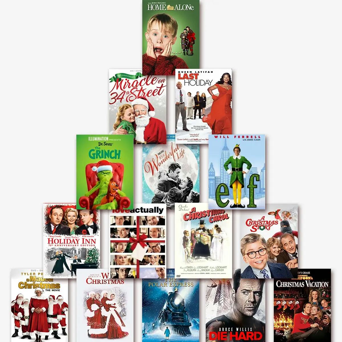 A stack of holiday-themed DVDs arranged in the shape of a Christmas tree.