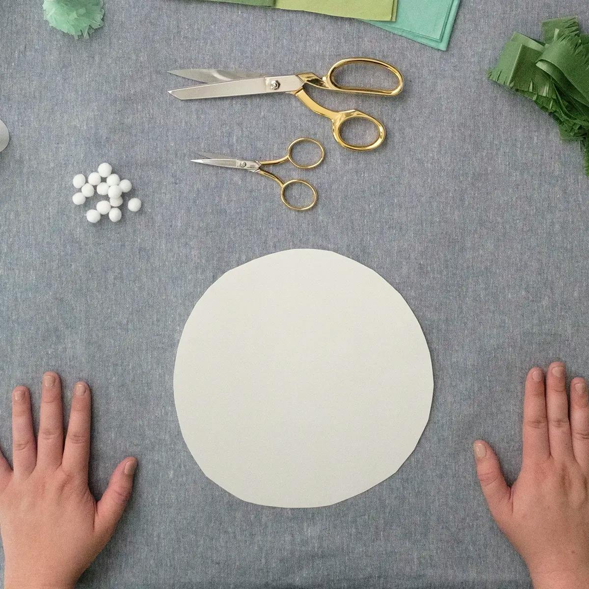 Paper circles traced from bowls - the start of a tutorial on creating a DIY paper Christmas tree.