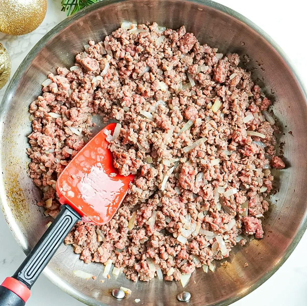 Cooking vegan ground beef ready for the sauce of a vegetarian lasagna recipe.