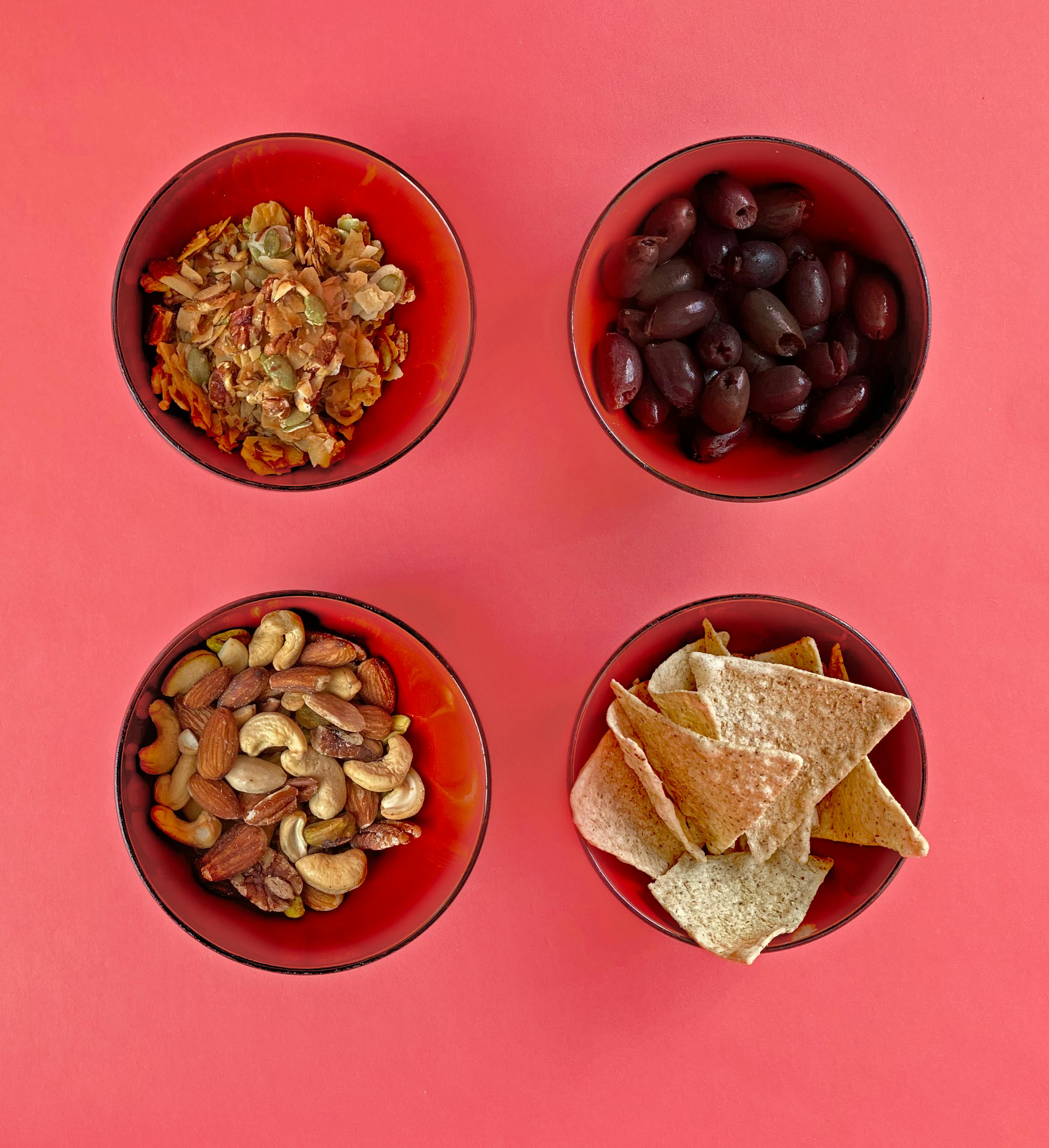 Bowls of Snacks on Red