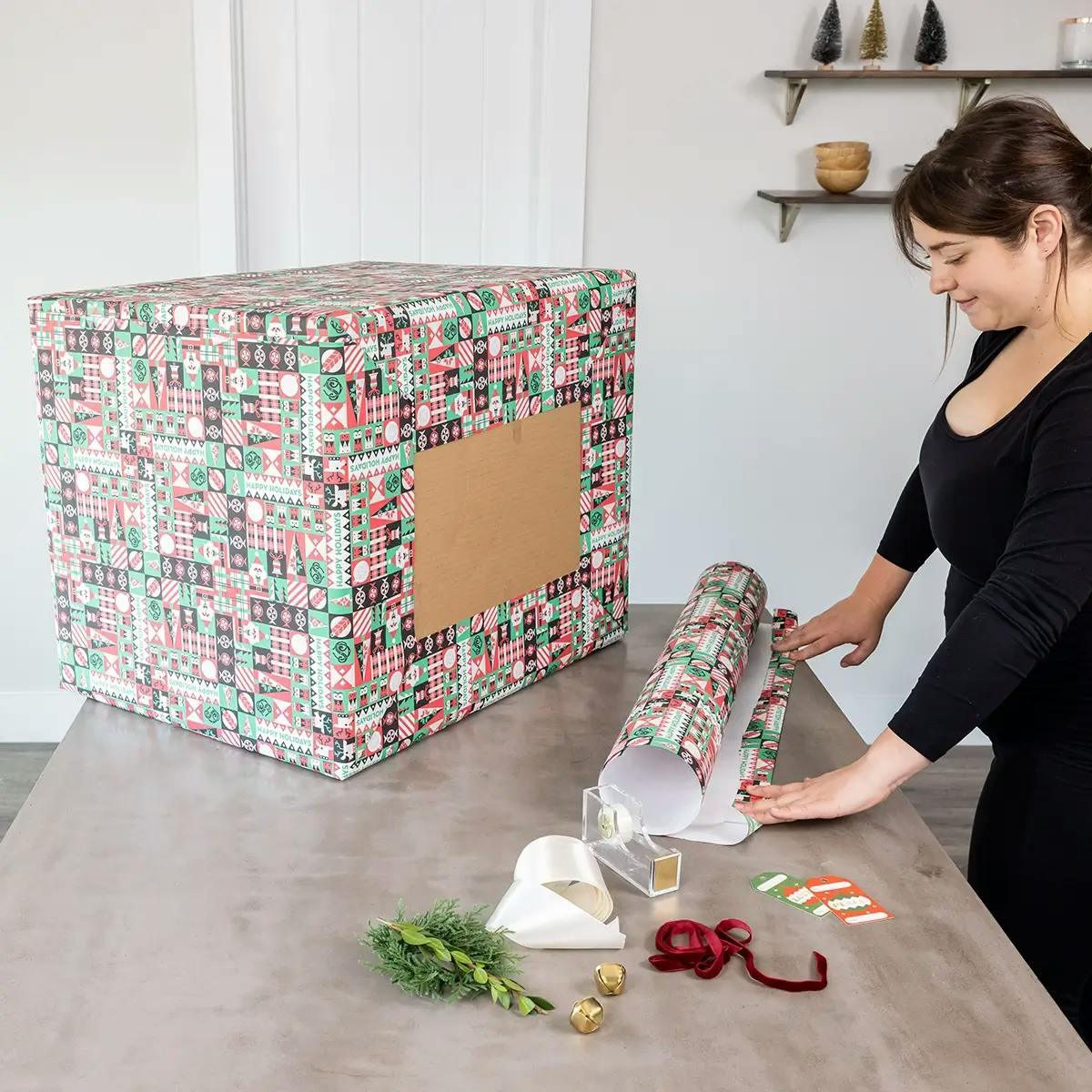 Folding the edge of the wrapping paper to make a neat edge when wrapping a large box.