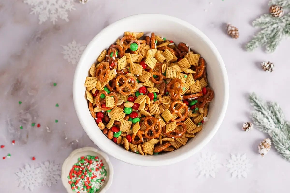 Bowl of chex mix showing a sweet and salted homemade recipe.