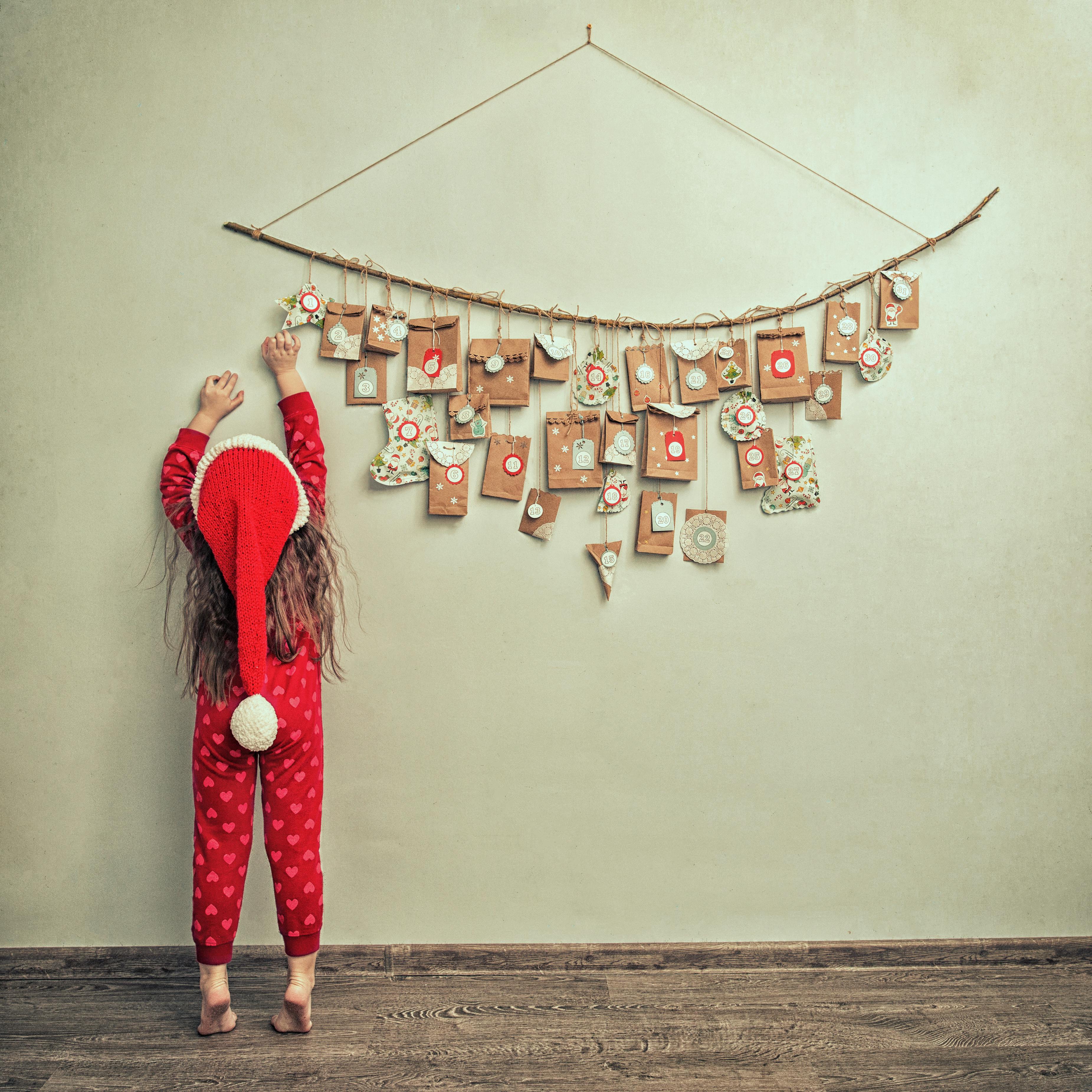 Child with hanging advent Calendar