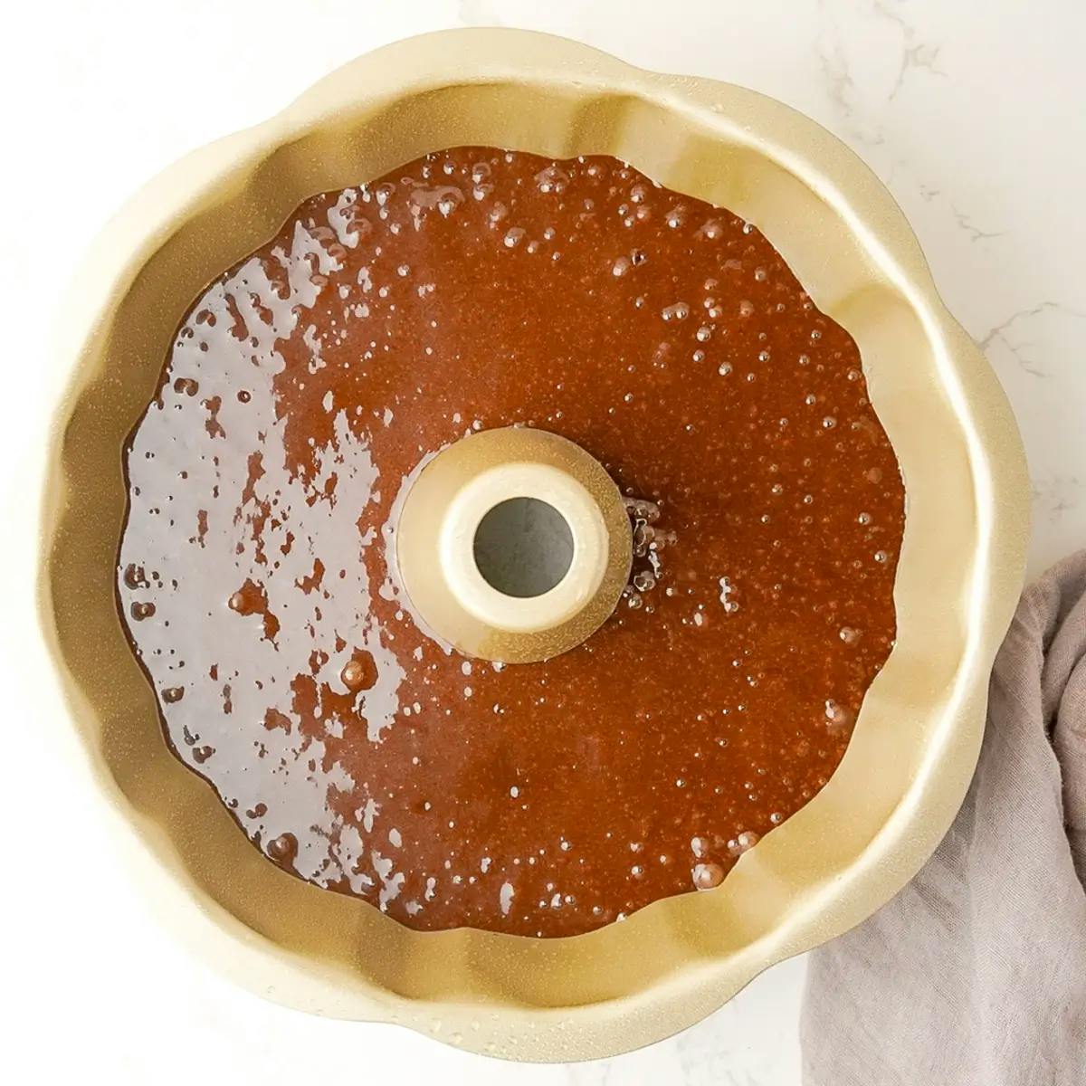 Vegan Chocolate Orange Cake batter in a bundt tin, ready to go into the oven.