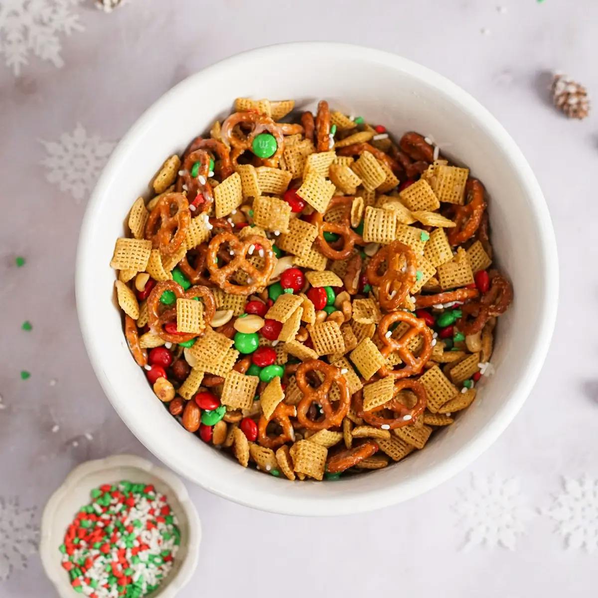 Bowl of chex mix showing a sweet and salted homemade recipe.