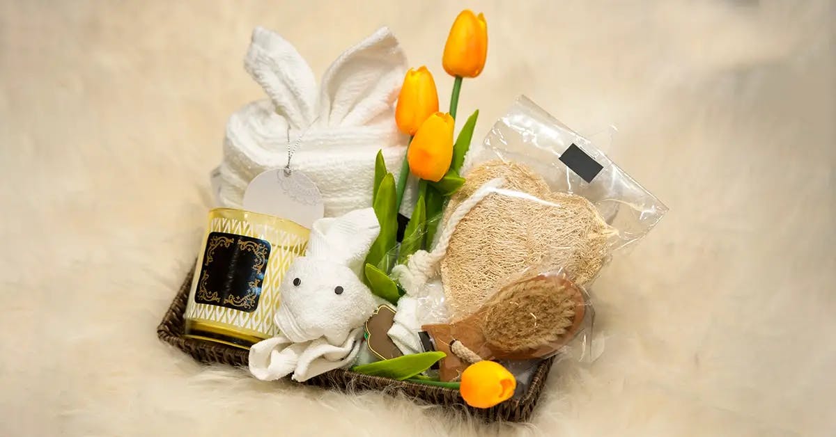 Easter basket for teens with candle, flowers, and spa supplies.