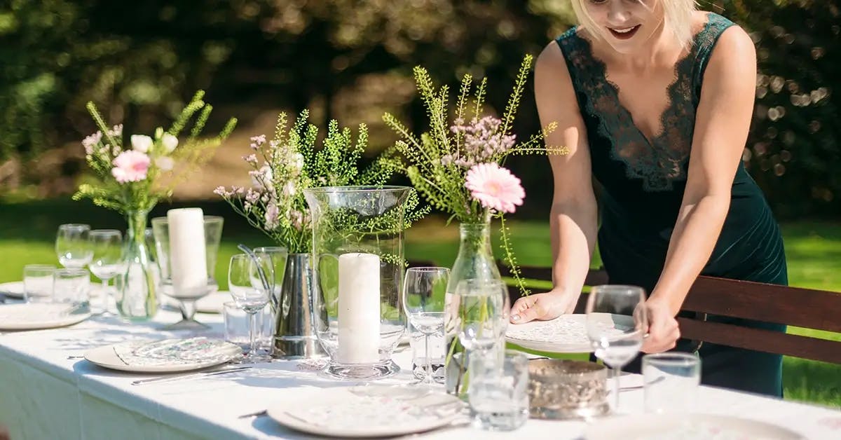 Woman setting table for Easter brunch