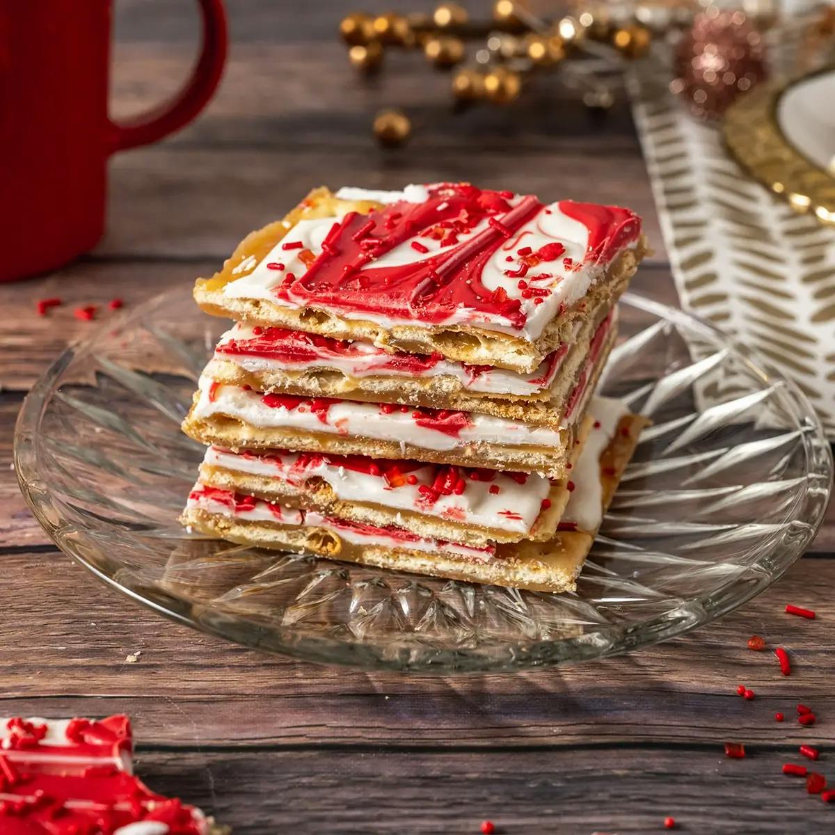 Christmas Crack with Saltines and white chocolate on a plate.