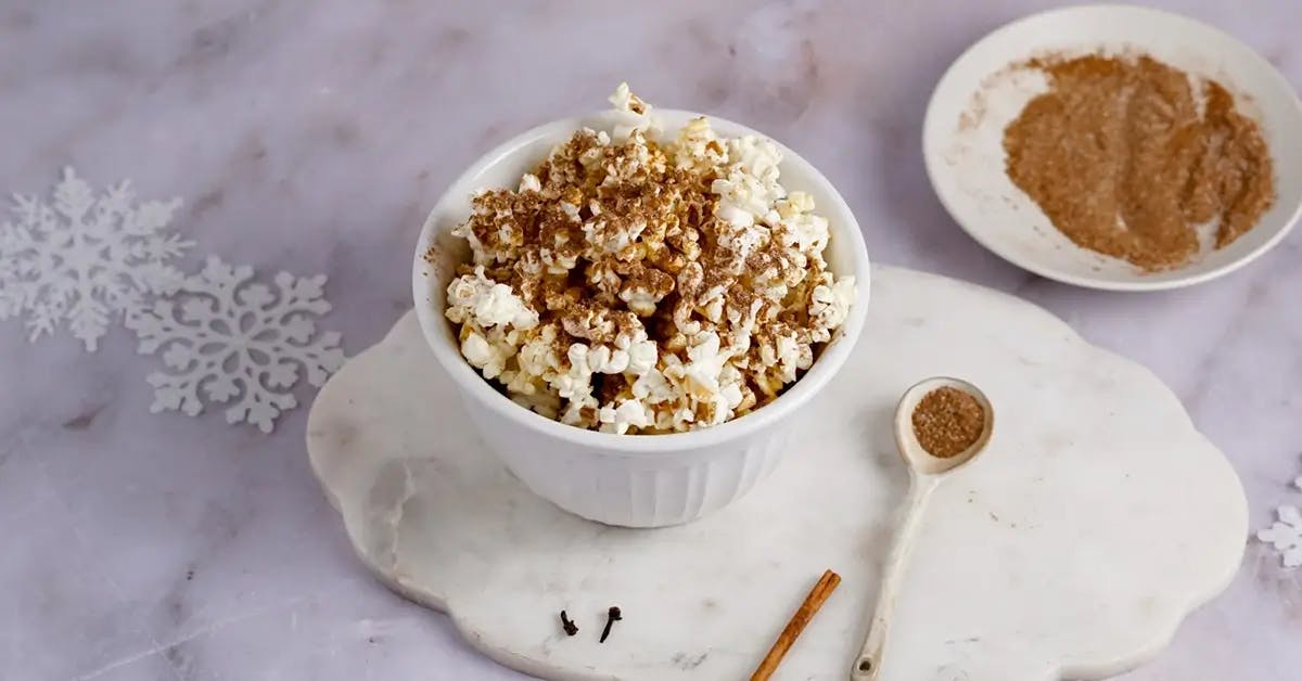 A bowl of Christmas popcorn tossed with gingerbread spices.