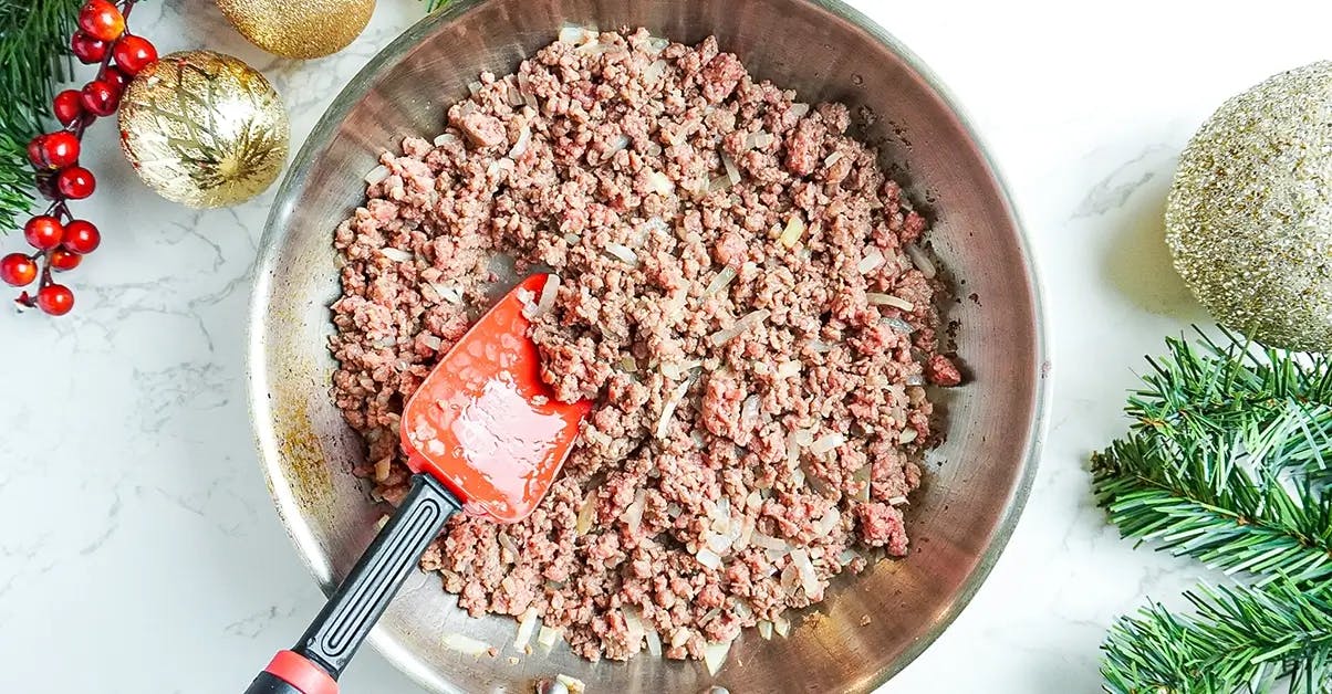 Cooking vegan ground beef ready for the sauce of a vegetarian lasagna recipe.