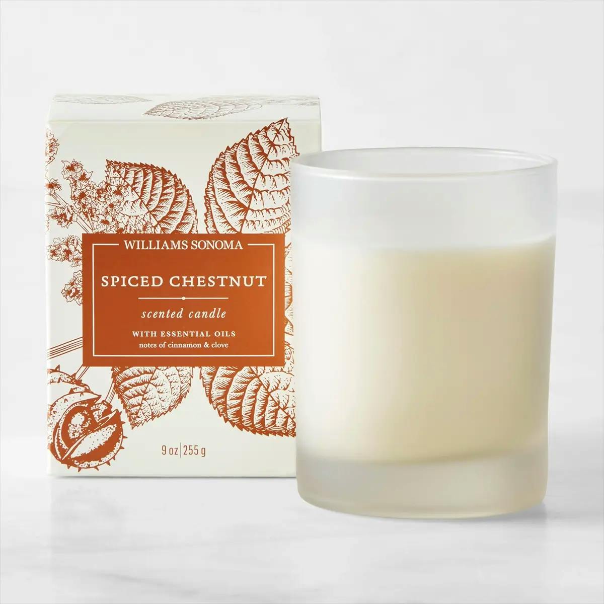 Spiced Chestnut Christmas candle in frosted glass jar by Williams Sonoma, with box in background.