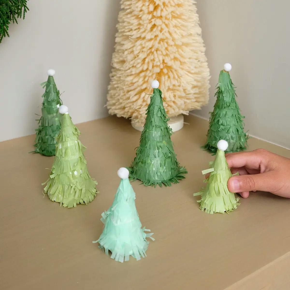A Christmas paper craft tutorial showing how to make a paper Christmas tree.