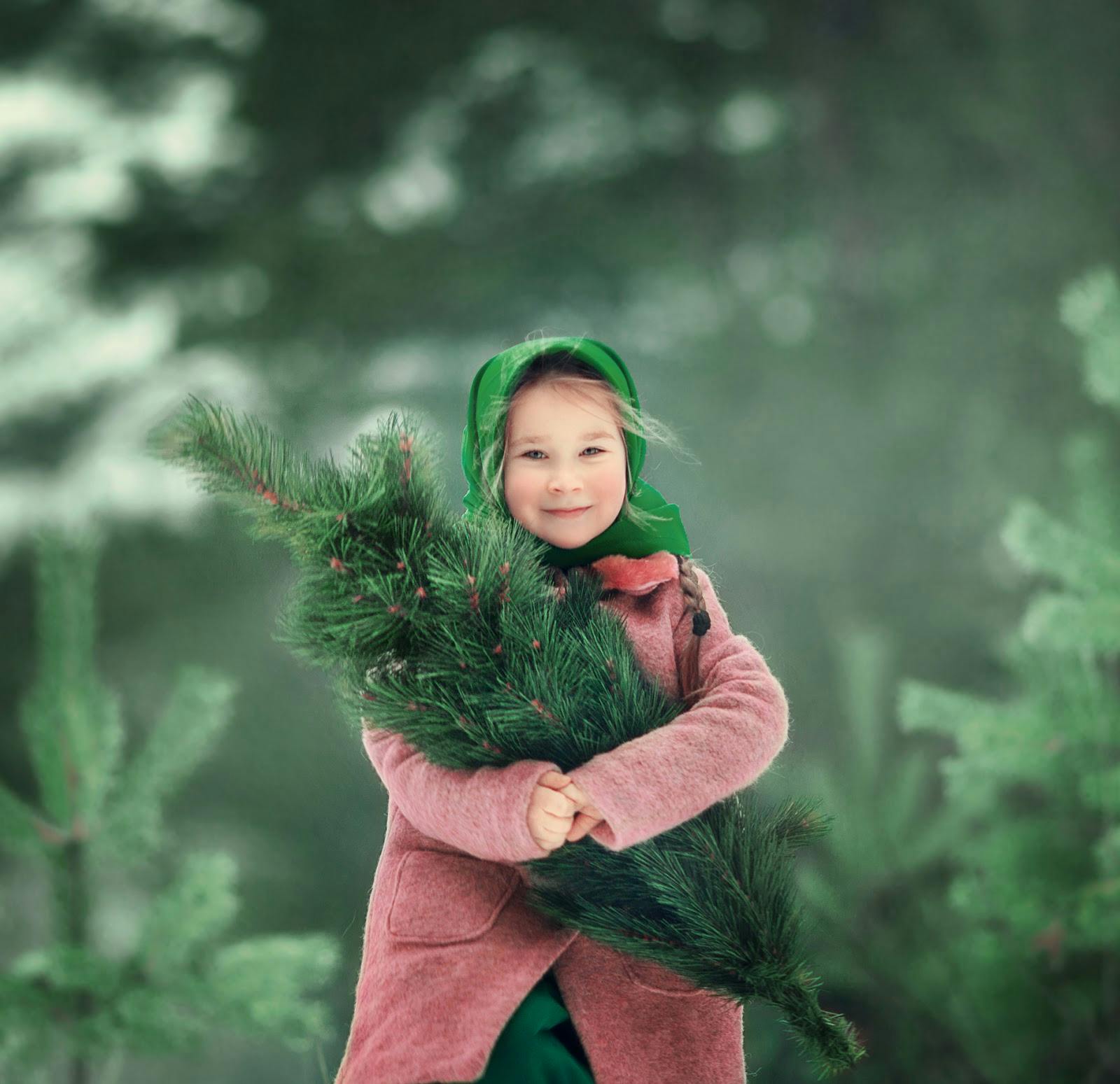 Girl holding tree