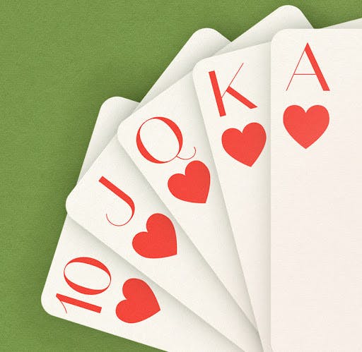 Hand of Cards Displayed on Green