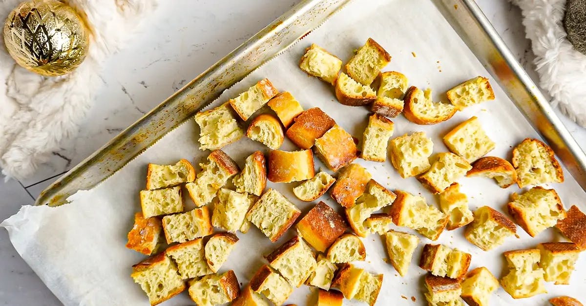 Toasting bread cubes in the oven ready for a vegan stuffing recipe.